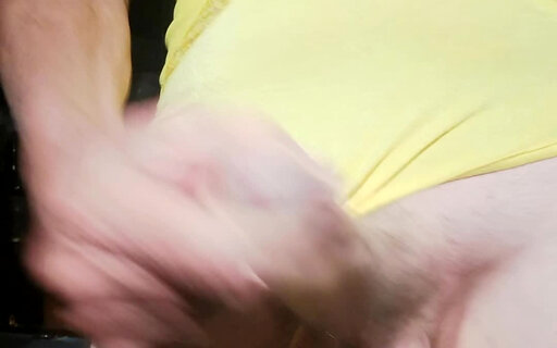 Jen jerks her cock in yellow bodysuit