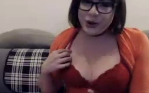 Velma Dinkley teasing and jerking her cock under her skirt