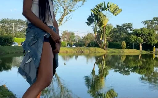 Laura pissing in the lake in public