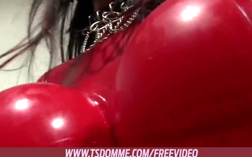 Brunette shemale in red latex dress fucks her lover