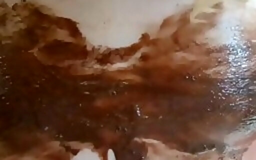 Naked body covered in chocolate sauce